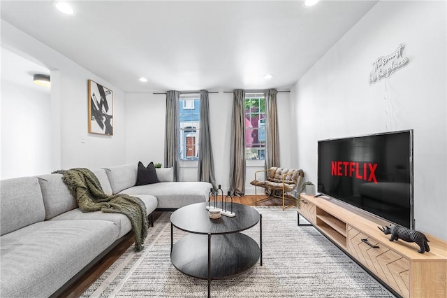 living room with recessed lighting and wood finished floors