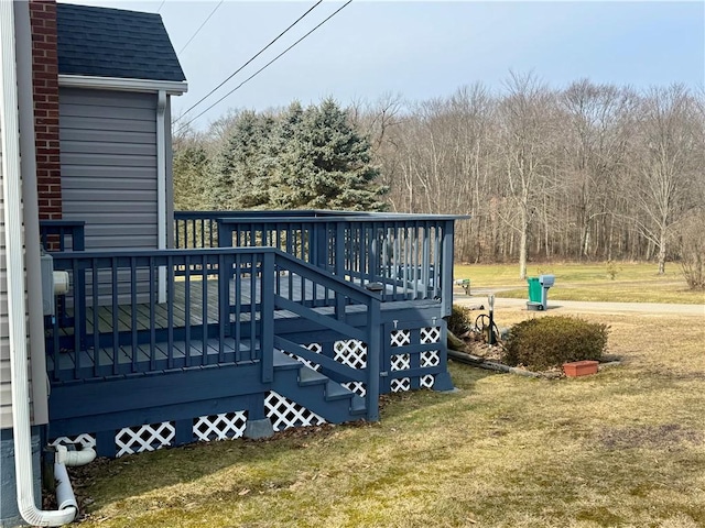 wooden deck with a yard