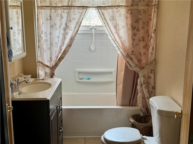 bathroom featuring toilet, tile patterned floors, shower / bath combo, and vanity