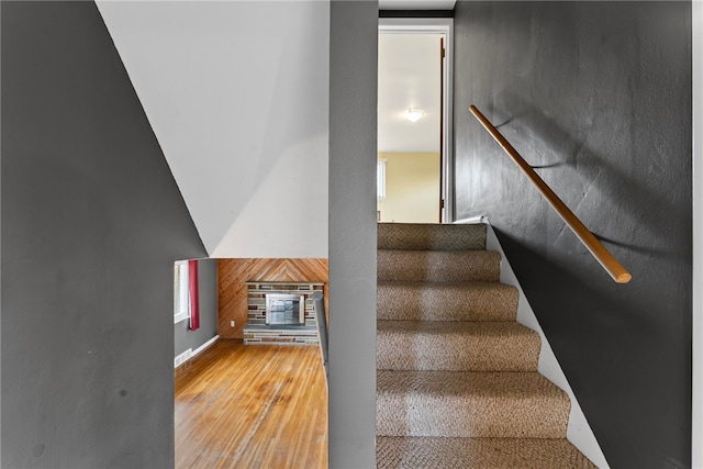 stairs with wood finished floors