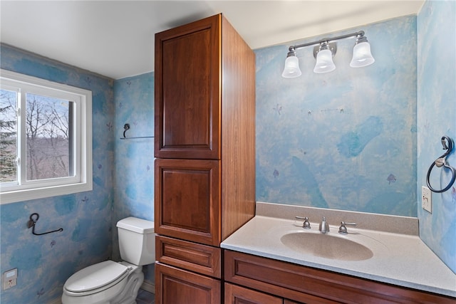 bathroom with toilet and vanity