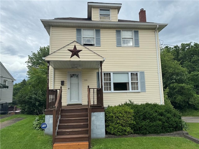 view of front of house featuring a chimney