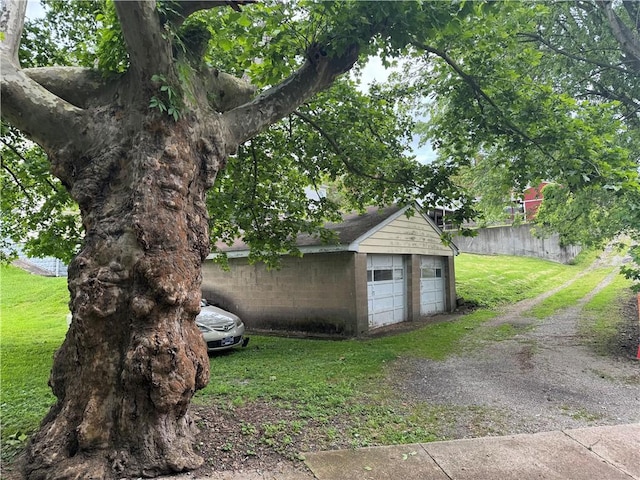 detached garage featuring fence