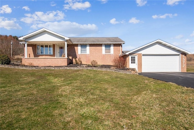 single story home featuring a porch, an attached garage, brick siding, driveway, and a front lawn