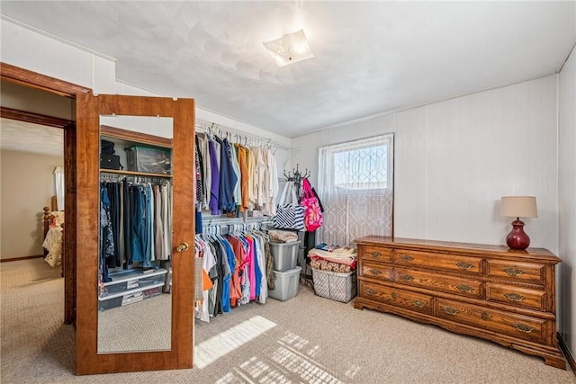 walk in closet featuring carpet