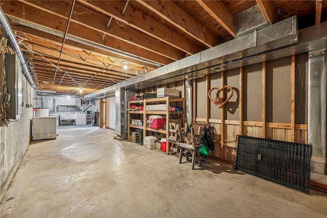 unfinished basement with separate washer and dryer