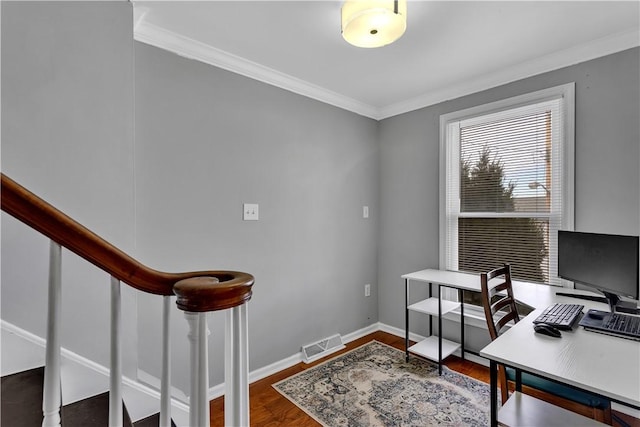 office area featuring visible vents, crown molding, baseboards, and wood finished floors