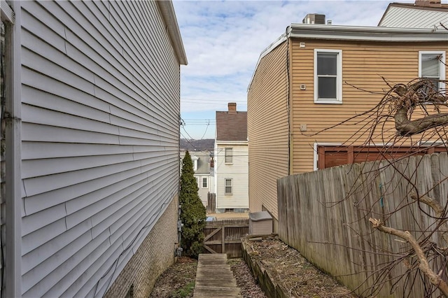 view of property exterior featuring fence