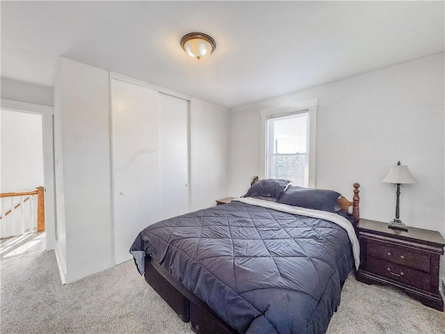 carpeted bedroom featuring a closet