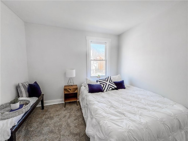 carpeted bedroom with baseboards