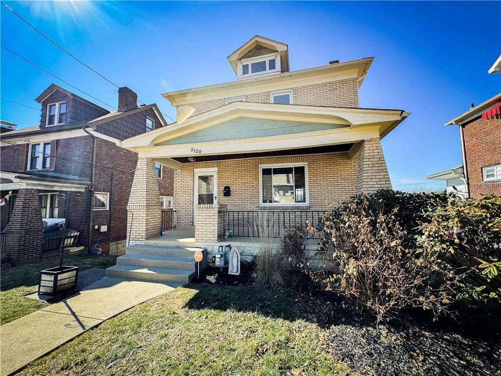 2120 Walton Ave, Overbrook, PA 15210 - traditional style home with a porch and brick siding