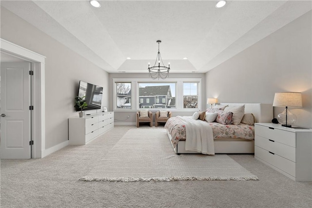 carpeted bedroom featuring a chandelier, a tray ceiling, recessed lighting, and baseboards