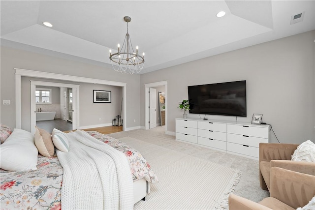 bedroom with recessed lighting, light carpet, visible vents, baseboards, and a raised ceiling