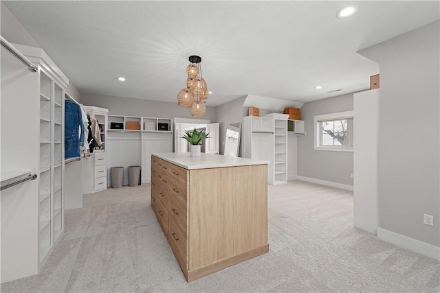 spacious closet featuring light carpet