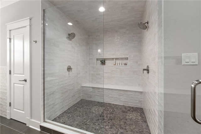 bathroom featuring a shower stall and tile patterned floors