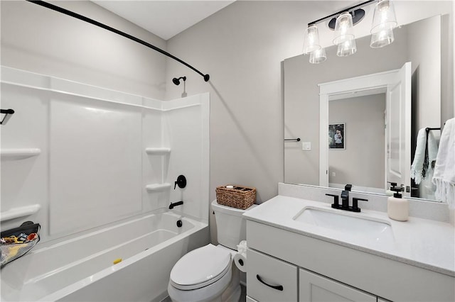 bathroom featuring toilet, vanity, and shower / bathtub combination