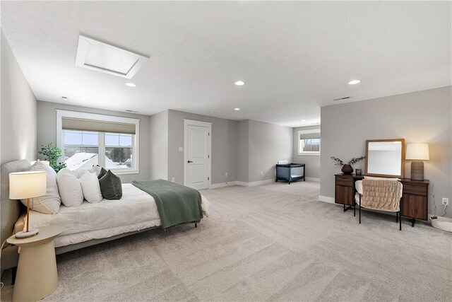 bedroom with recessed lighting, light colored carpet, visible vents, and baseboards