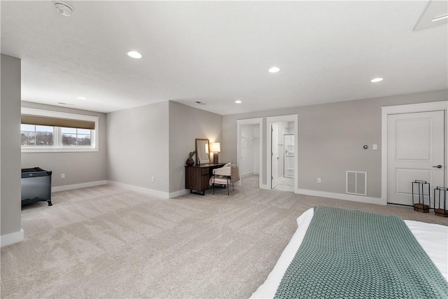 sitting room with baseboards, recessed lighting, visible vents, and light colored carpet