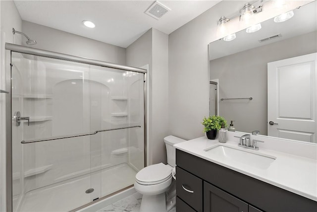 bathroom featuring marble finish floor, a stall shower, and visible vents