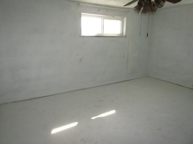 basement featuring a ceiling fan