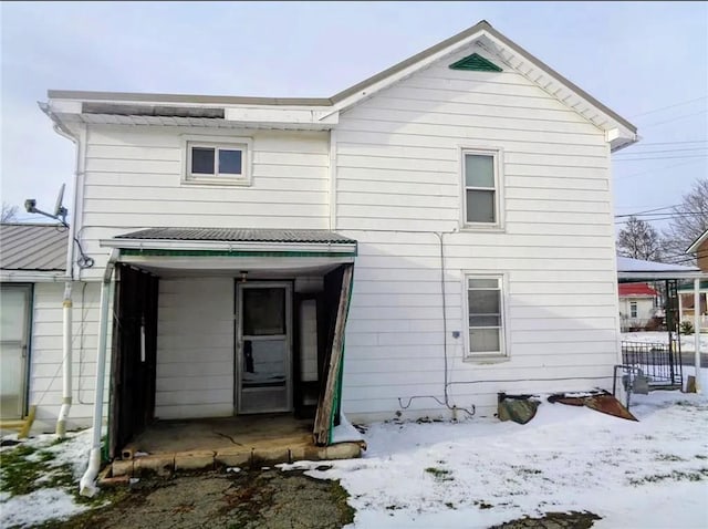 view of snow covered house