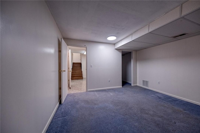 interior space featuring carpet, baseboards, and visible vents