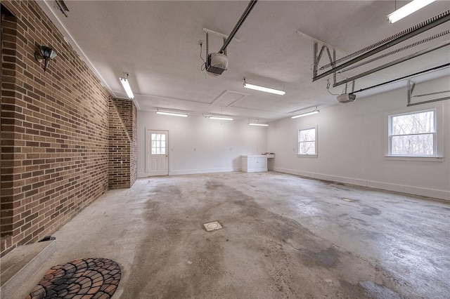 garage featuring baseboards and a garage door opener