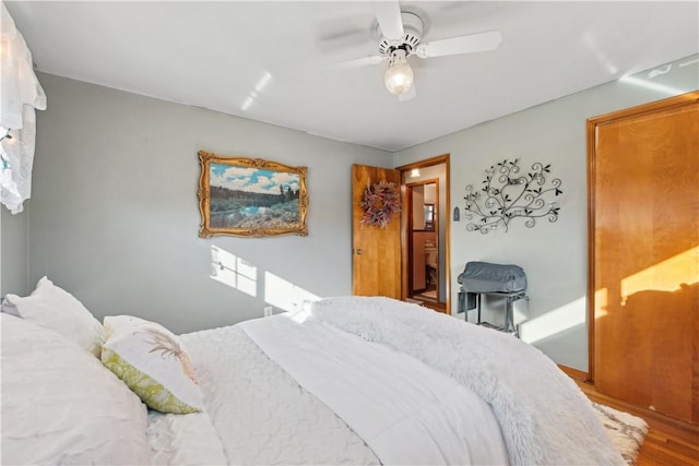 bedroom featuring wood finished floors and a ceiling fan