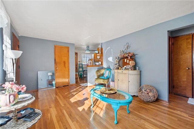 interior space featuring baseboards and wood finished floors