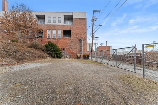 view of building exterior with fence