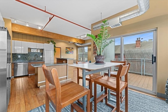 dining area with wood-type flooring