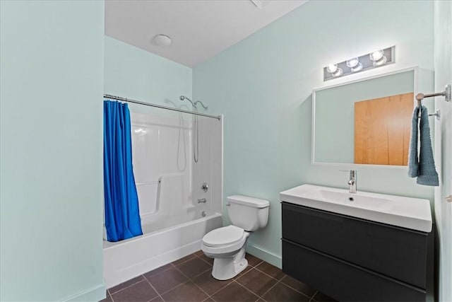 bathroom featuring baseboards, toilet, tile patterned flooring, shower / bath combo with shower curtain, and vanity