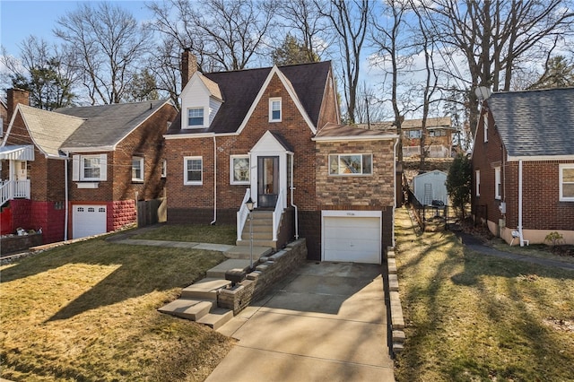 view of front of property with brick siding, concrete driveway, a front yard, a garage, and stone siding