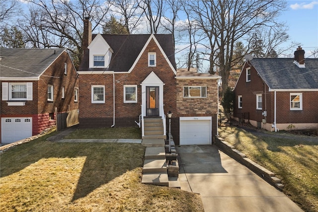 view of front of house featuring brick siding, an attached garage, stone siding, driveway, and a front lawn