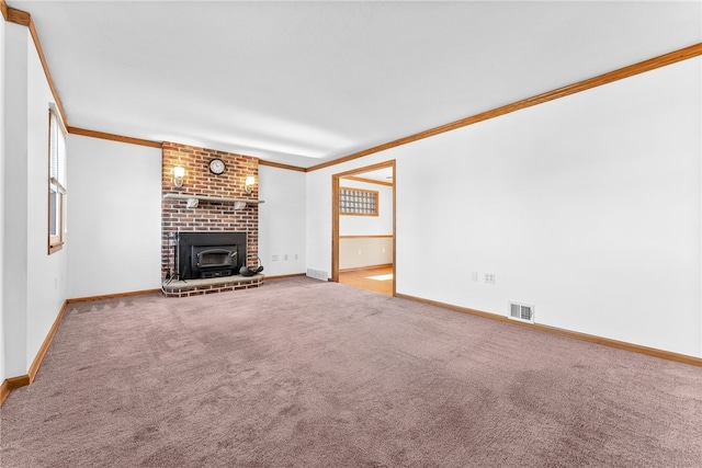 unfurnished living room with carpet floors, crown molding, visible vents, a brick fireplace, and baseboards