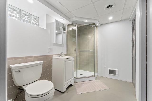 full bath featuring a stall shower, visible vents, vanity, and toilet