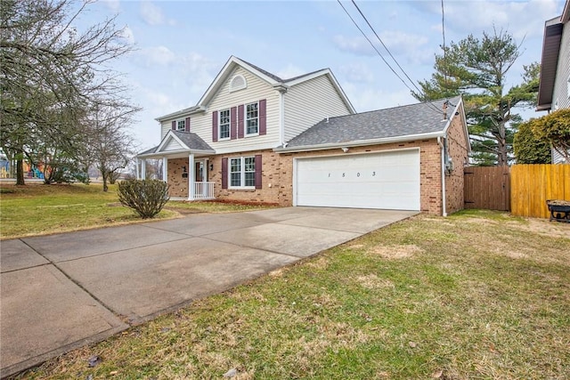 traditional-style home featuring brick siding, concrete driveway, fence, a garage, and a front lawn