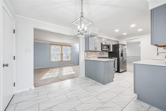 kitchen featuring appliances with stainless steel finishes, gray cabinets, crown molding, and light countertops