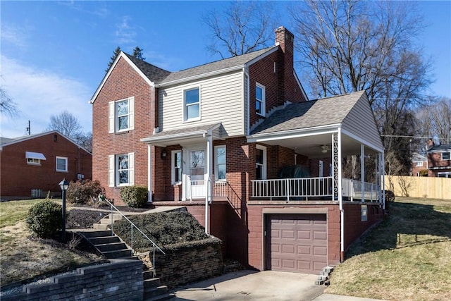 view of front facade with a garage, brick siding, concrete driveway, stairway, and a chimney