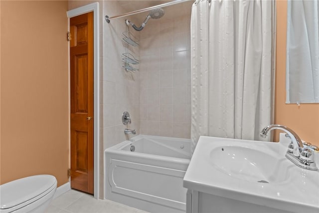 full bathroom featuring tile patterned floors, vanity, toilet, and shower / bath combo with shower curtain