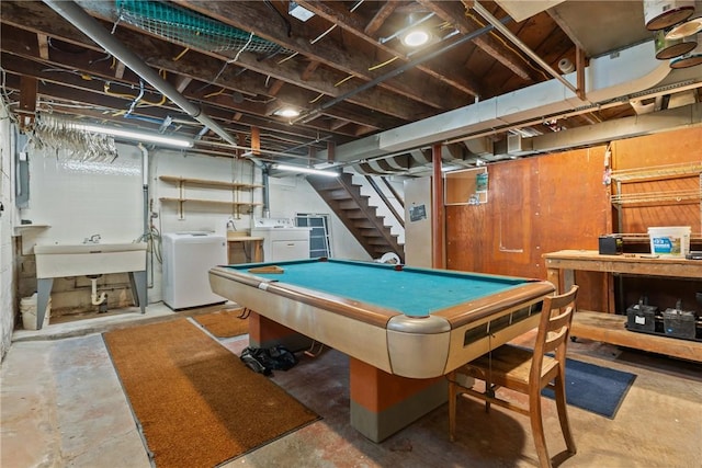 playroom with a sink, unfinished concrete floors, washer and dryer, electric panel, and billiards