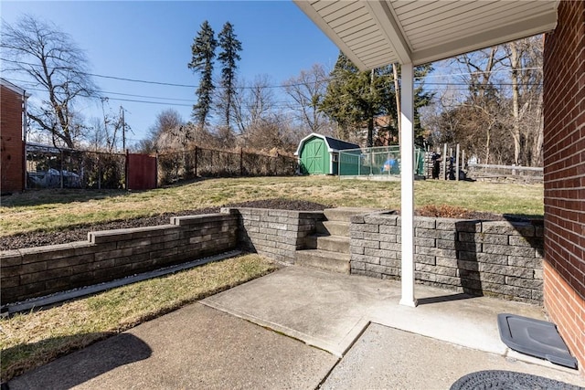 view of patio / terrace with a fenced backyard, a shed, and an outdoor structure