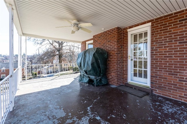 view of patio with ceiling fan and a grill