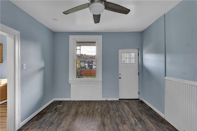 entrance foyer with ceiling fan, baseboards, and wood finished floors