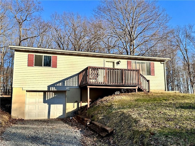 view of front facade with a garage and a deck