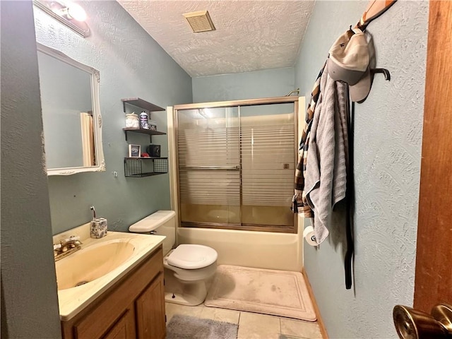 full bath featuring visible vents, tile patterned flooring, combined bath / shower with glass door, a textured ceiling, and vanity