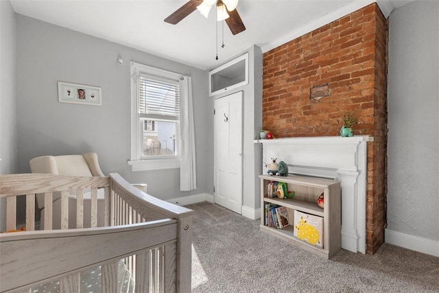 bedroom with ceiling fan, carpet floors, and baseboards