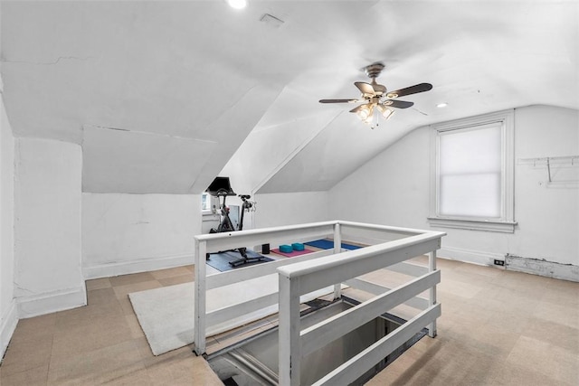 bonus room featuring lofted ceiling, ceiling fan, and baseboards