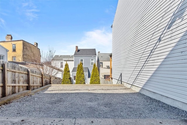 view of yard with a residential view and fence