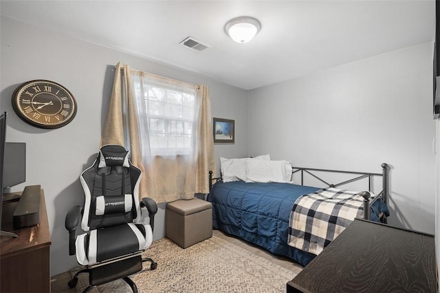 bedroom featuring visible vents